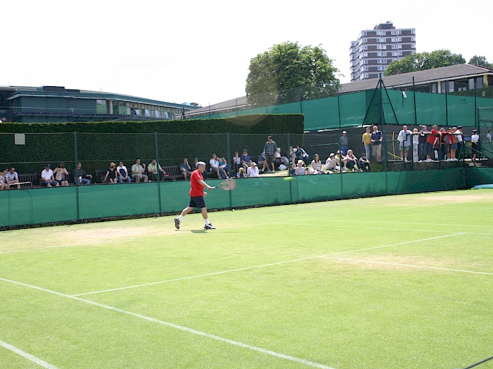 Sam hitting with coach in Wimbledon practice court